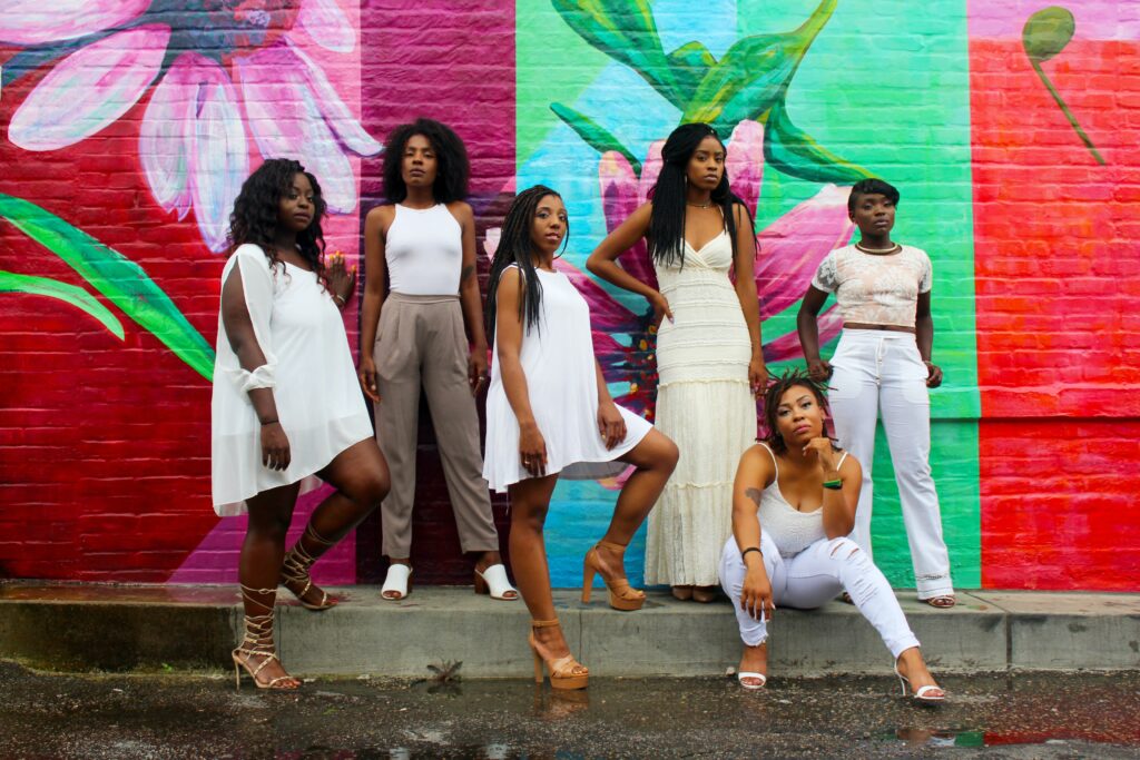 photo of six confident women posing and looking at the camera